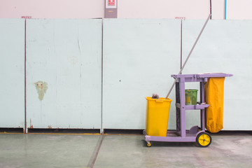 The cleaning trolley (service cart) in front of wall