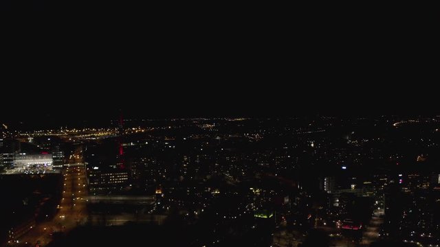 Aerial drone view of Illuminated city center at night and fireworks.