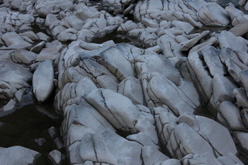 Fototapeta na wymiar Silver riverstones of a mountain river in Transcarpathia, Ukraine