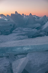 Fototapeta na wymiar cracked ice texture of a clear transparent lake