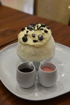 Bingsoo or Patbingsu is a Korean dessert consist of shaved ice dessert with sweet toppings such as fruit or berry or Sweet Syrup or Chocolate Syrup.