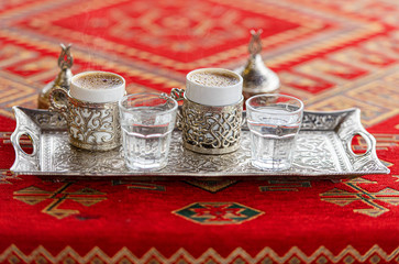 Two Cups with traditional Turkish Beverage Turkish Coffee on the Table 