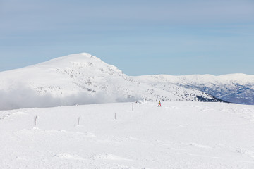 Fototapeta na wymiar Off-piste skier in the Sierra de Guadarrama in Madrid, Spain, covered by snow.