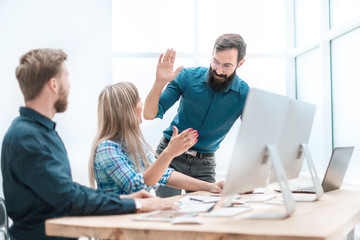 business colleagues giving each other a high five