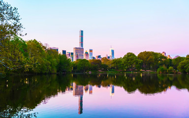 Pond at Central park New York, great design for any purposes. Midtown Manhattan, USA. View with Skyline of Skyscrapers architecture in NYC. Nature background. Urban cityscape. NY, US