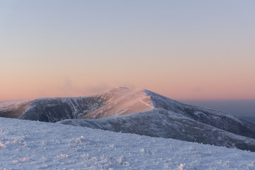Beautiful panoramic view of sunrise in winter carpathians.  Borzhava ridge. Ukraine