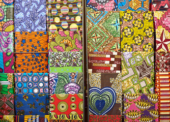 Colorful textiles hanging on display in a fabric shop