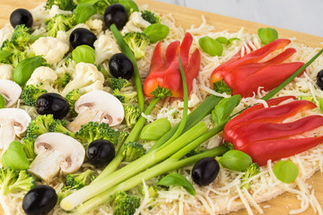 Vegetarian heart shaped pizza for Valentine Day.