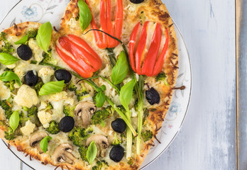 Vegetarian heart shaped pizza for Valentine Day.