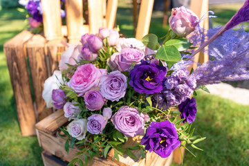 Bouquets of fresh flowers decoration of the festive table. Celebrating an open air party. Decor Details