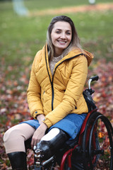 Beautiful disabled woman sitting in a special chair.