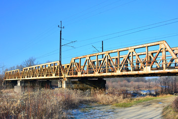Small old rusty steel train trestle bridge in Nowy Sacz, Poland