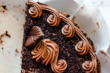 Chocolate cake cut into several pieces with decoration