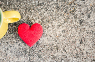 Fototapeta premium Valentines day background with a red heart with a yellow glass