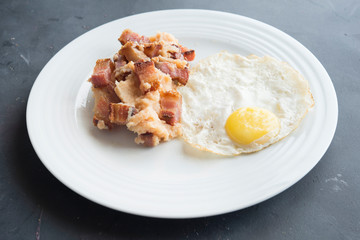 mashed potatoes with slice of bacon and egg