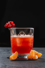 glass of Aperol spritz Italian orange cocktail with mandarins and rowan berry