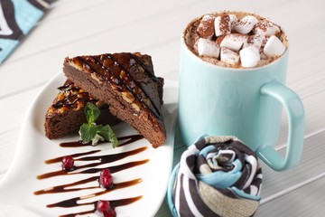small sweet marshmallows with cocoa and chocolate cake