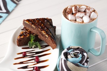 small sweet marshmallows with cocoa and chocolate cake