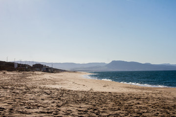 beautiful panorama of the famous beaches of the Sardinian sea with the isola rossa and castelsardo  behind