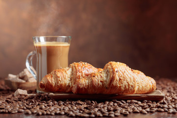 Coffee with cream and croissant.