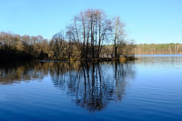 Fototapeta na wymiar Beautiful view of the Straszynskie Lake on a sunny day, Straszyn, Pomerania, Poland. There is a water intake for Gdansk here.