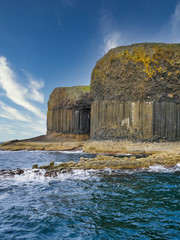 Columns of jointed volcanic basalt rocks in which the vertical joints form polygonal columns, on...