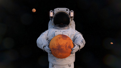 astronaut holding Mars, Phobos and Deimos orbiting the planet