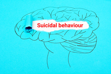 Suicidal behaviour. Mental health brain torn paper concept. Mental disorder.