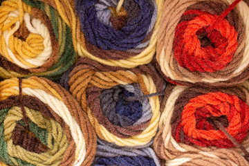 background texture of plush multicolored yarn. Beautiful thread pattern. balls of yarn.