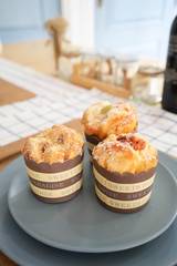 A blue plate of muffins cupcakes on the table -squishy