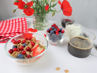 Breakfast served with coffee, cereals and fruits.