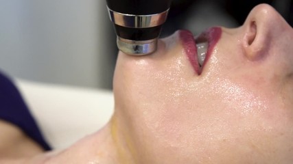 close up view of a young polish European woman receiving a relaxing facial treatment at a local spa from a well trained dermatologist. The client beauty therapy is great for skin care and health - Powered by Adobe