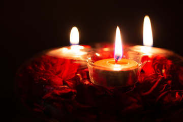 red candles in a candlestick on a black background