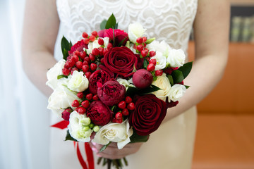 Bride with wedding bouquet, closeup