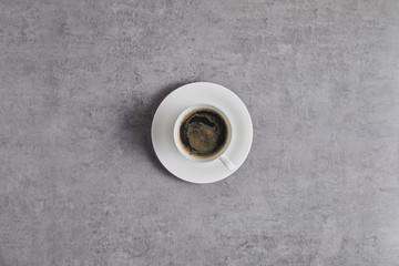 Top view of coffee cup on background..