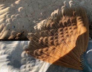 Partial solar eclipse on the sand
