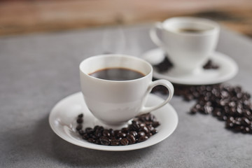Hot coffee cup and coffee beans. .
