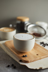 Coffee cup and coffee beans on table..