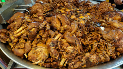 Stewed pork legs show at shop in the night market.