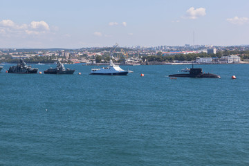 Fototapeta na wymiar Formation of warships in the Sevastopol Bay, Crimea