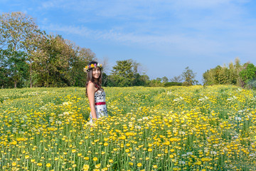 Fototapeta premium Smile girl with flower crown on hair smell blossom white flower.