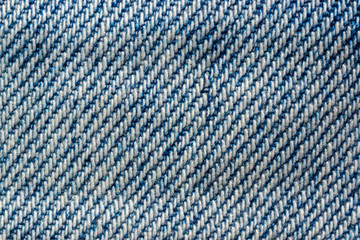 Texture of blue denim jeans macro