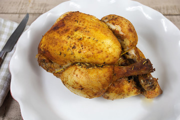 whole roast chicken in a dish