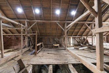 Old and dusty creepy wooden attic with roof framework structure of the old house Awesome horror attic