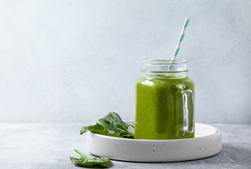 spinach smoothie in glass bottle