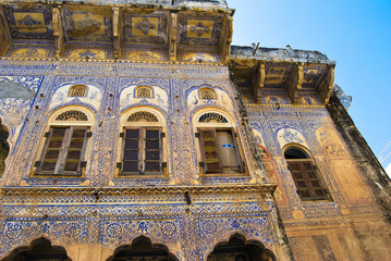Facade of an old mansion with a painting in the city of Sikar, Rajasthan, India