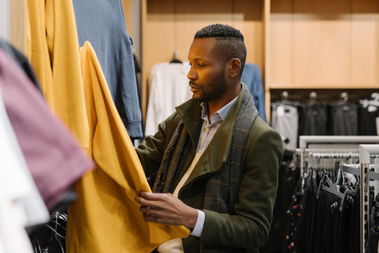 Stylish man shopping in a clothes store