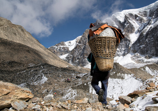 Carrier at Chonbarden Glacier, Dhaulagiri Circuit Trek, Himalaya, Nepal