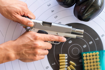 Guns with ammunition on paper target shooting   practice