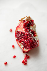 fresh and juicy pomegranate on marble background